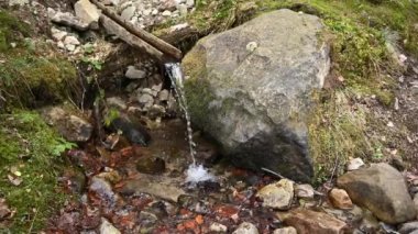 Source of pure mineral water in the mountains. Mountain spring in Ukraine.