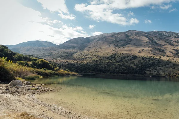 stock image Kournas Mountain Lake in Greece. Cozy summer day and calm water in the lake.