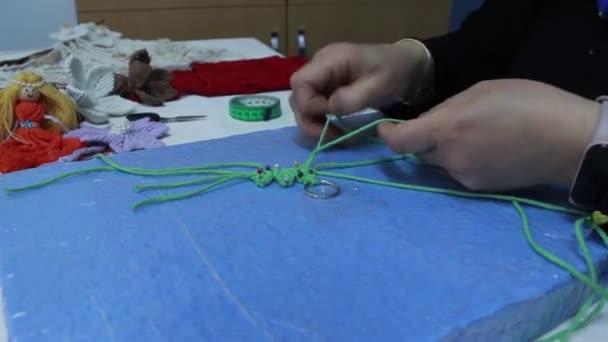 Woman Making Key Chain Knitting Wool Rope — Stock Video