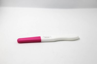 pregnancy test device on a white background