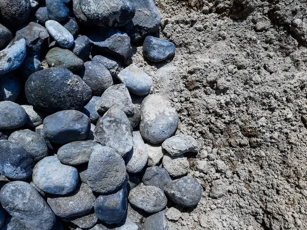 portrait of a pile of stones and soil with a top view as building material