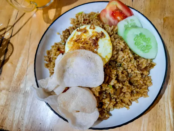 a plate of fried rice with a top view