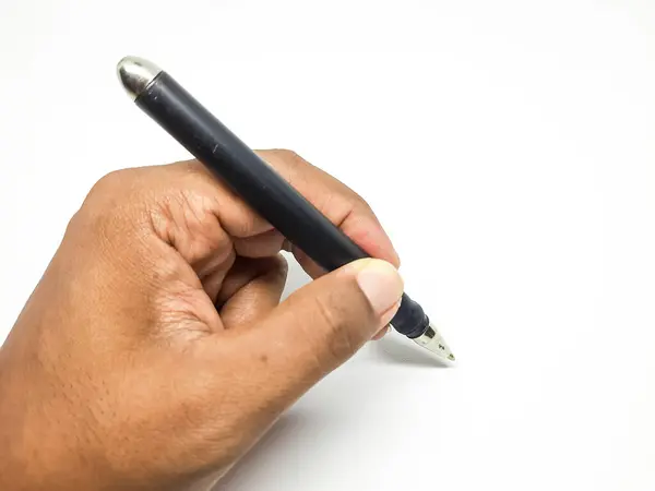 Left hand of a man holding a pen for writing on an isolated background