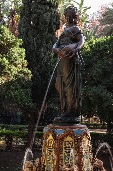 Discovering the beauty of La Ninfa del Cantaro (spanish for the Nymph of the Jug), a stunning bronze sculpture and fountain in the City Park of the Spanish city of Malaga