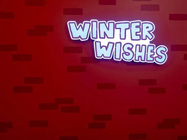 Beautiful decorated christmas backdrop with winter wishes word on top. Merry Christmas & Happy New Year wallpaper. Place text on red wooden xmas backdrop