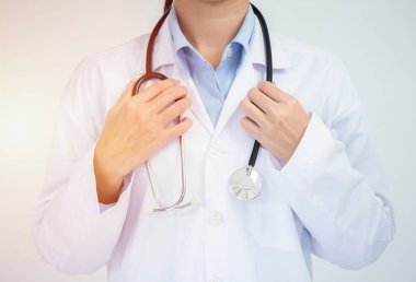 Crop image of professional confident young female asian doctor in white coat, stethoscope over neck, ready help patient, fight disease
