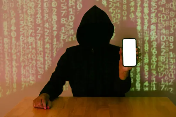 Dark face hacker holding smartphone with isolate screen over binary code digital background. Copy space.