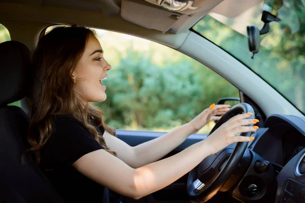 Stock image Inattentive female driver on road. Moment bofore car crash. Car accident concept in the countryside