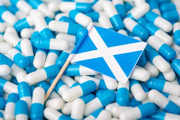 Шотландська Медична Система Прапор Шотландії Між Білими Синіми Капсулами — стокове фото