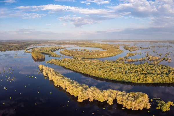Aerial view of flooded river in Spring. Desna river flooded fields and forests around