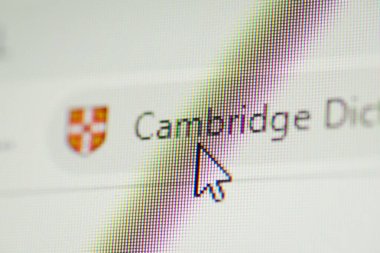 Mouse cursor on bookmark of Cambridge dictionary site. Chernihiv, Ukraine - January 15, 2022
