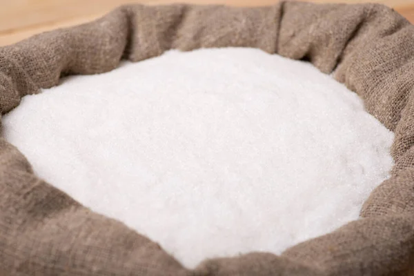 White sugar sand in linen sack. Concept of sugar