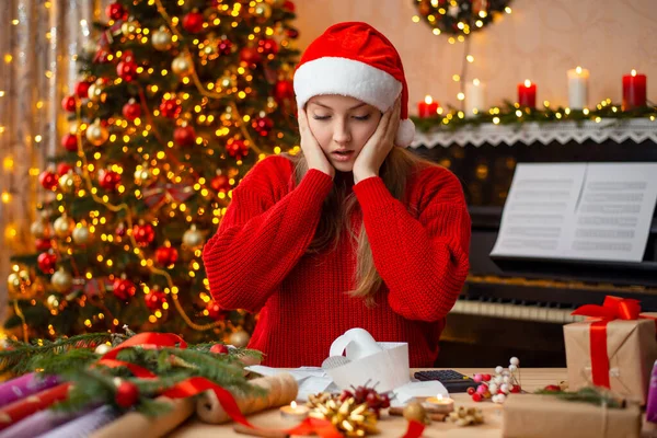 Frustrated Young Girl Red Sweater Santa Hat Stressed Facial Expression — 스톡 사진