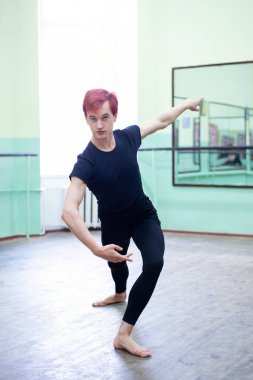 Portrait of a dancer while practicing his performance. Dancing practice in choreography hall
