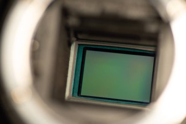 Macro photo of an APS-C camera sensor. Old dslr camera showing its sensor behind mirror before cleaning