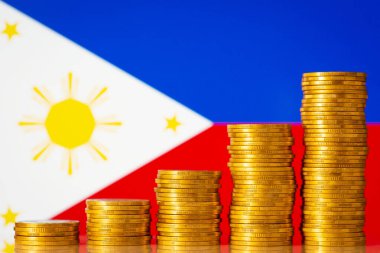 Uprising graph of coin stacks against flag of Philippines. Concept of development of Philippines country, positive economy growth, financial success