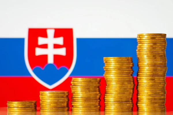 Uprising graph of coin stacks against flag of Slovakia. Concept of development of Slovakia country, positive economy growth, financial success