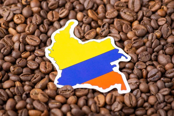 Flag and map of Colombia in coffee beans. Concept of agribusiness of growing coffee in Colombia