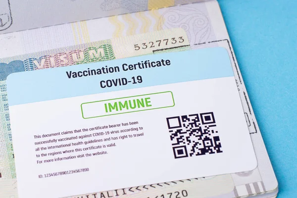 Vaccination certificate and visa in international passport. Concept of giving visas and allowing to travel only for immune citizens and foreigners