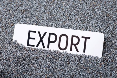 Paper with inscription Export on poppy seed grain. Trade of poppy plant seed between countries concept
