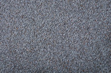 Background of dark poppy seed. Top down shot of poppy seed on the table