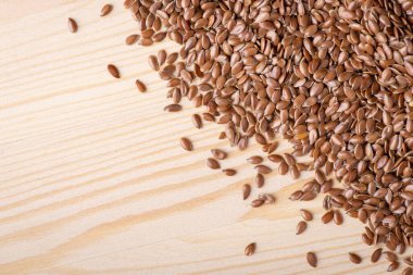 Linen grain on the table. Top down shot of linen grain on wooden table
