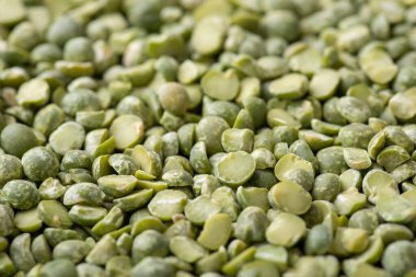 Macro shot of green pea broken in half. Cooking with green pea