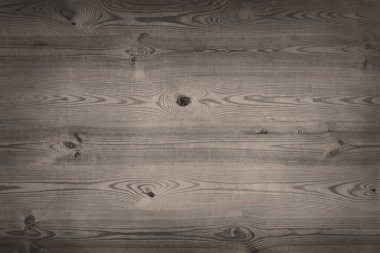 Dark wood board. Background of black inked table