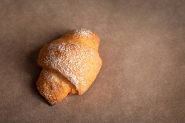 Homemade croissant on baking paper