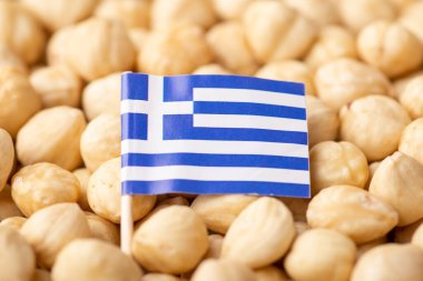 Flag of Greece on hazelnuts. Origin of hazelnuts, growing nuts in Greece