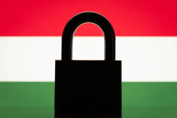 Silhouette of lock against flag of Hungary. Concept of closed country Hungary, sanctions, restrictions