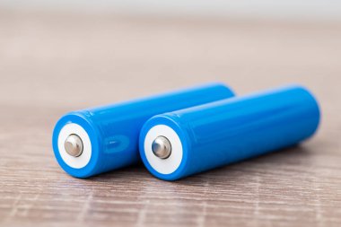 Two 18650 type accumulators on table. Using modern 3.7 v batteries in electronics