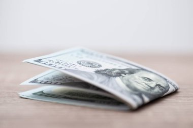 Close up shot of 100 american dollar bills on the table. US currency, world money, business and prosperity concept