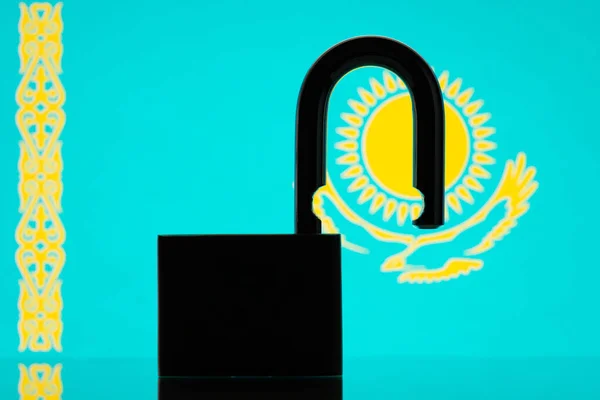 Silhouette of open lock and flag of Kazakhstan on the background. Open borders for travellers to Kazakhstan, freedom concept