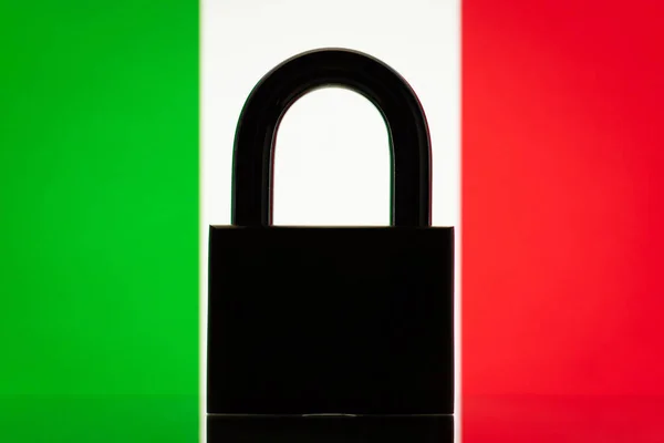 Flag of Italy with closed lock on the foreground. Concept of sanctions on Italy, embargo on some goods and services