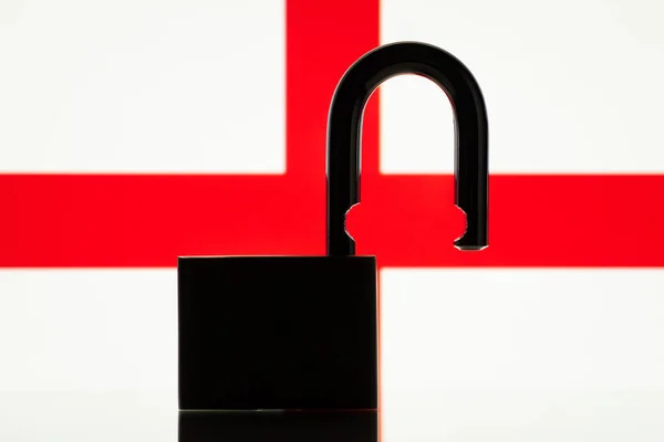 Silhouette of open lock against flag of England- part of UK. Concept of England open to the world, close relationships in trade, politics