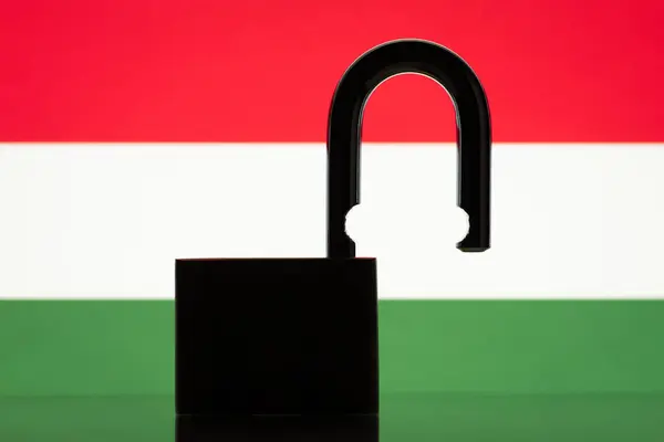 Silhouette of open lock against flag of Hungary. Concept of Hungary open to the world, close relationships in trade, politics with other countries