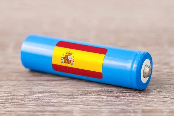 Rechargeable li-ion battery with flag of Spain. Production of lithium batteries in Spain