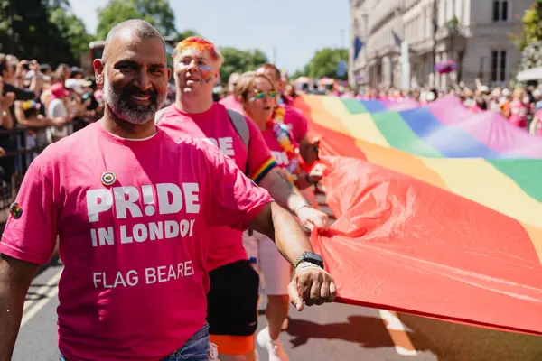 stock image London, England UK. 29 June 2024. Pride in London parade. People marching and watching the parade.