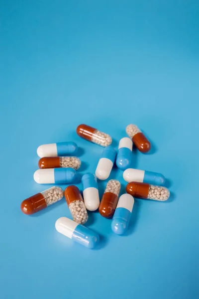Many Pills Capsules Blue Background Disease Treatment Concept — Fotografia de Stock