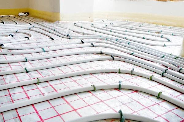 Installation of underfloor heating pipes for water heating. Heating systems. Pipes for underfloor heating