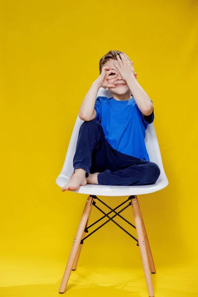 Cheerful Little Fair Haired Boy Blue Shirt Pants Sitting Chair — 图库照片