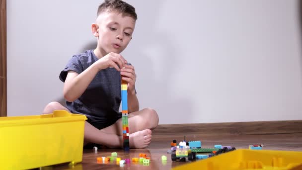 Boy Plays Constructor Builds Multi Colored Cubes Development Child Construction — Stock Video