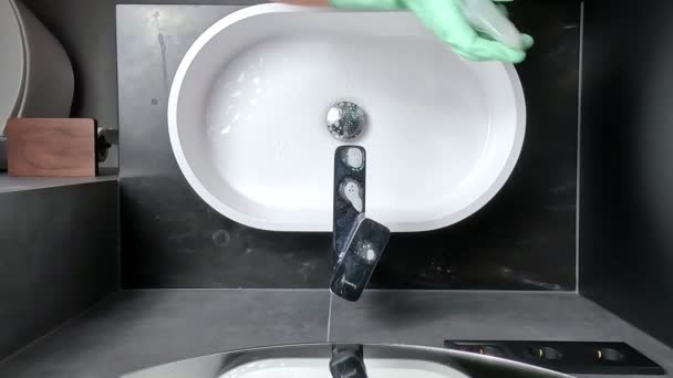Woman Maid Wizard Cleans Sink Faucet Bathroom Detergent Wearing Green — Stock Video