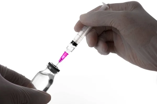 stock image Doctor or scientist hands wear rubber gloves holding and using syringe to suck liquid vaccines from medicine vials in the laboratory- Health Beauty and medical concepts- Isolated on white background