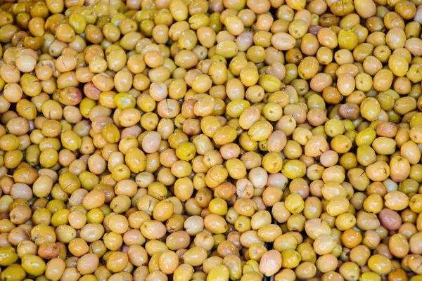 Green olives as health food preserved in olive oil