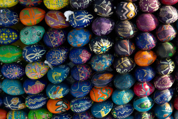 Easter eggs forming a shape on snow