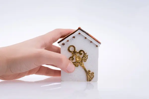 Hand Holding Golden Key House White Background Stock Picture