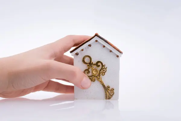Hand Holding Golden Key House White Background Stock Image