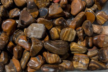 tiger's eye and hawk's eye gemstone as natural mineral rock specimen clipart